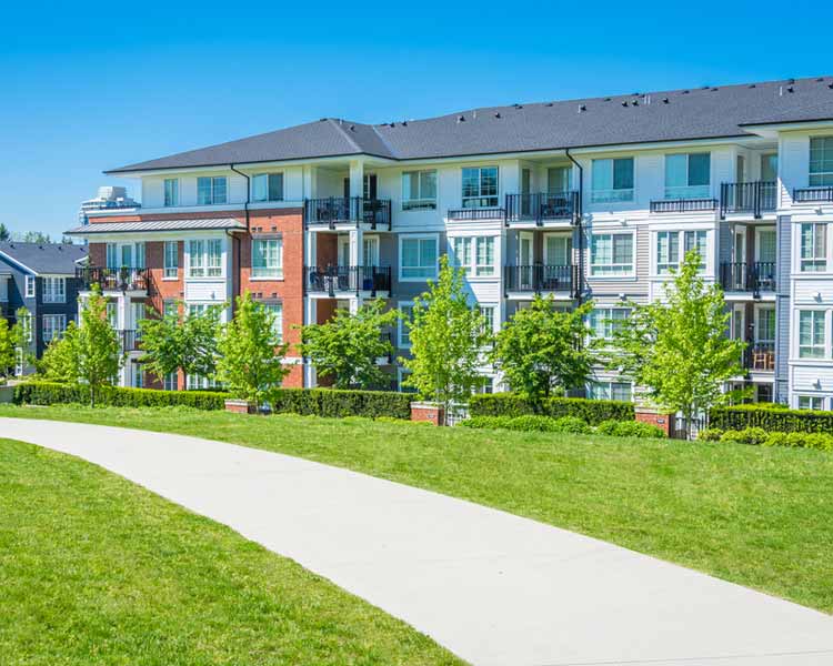 Apartment complex with green yard