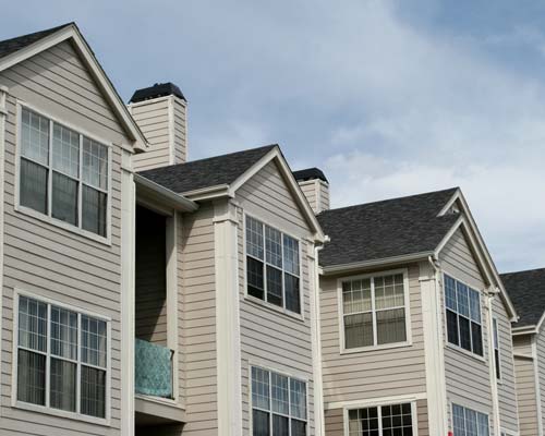 Gray siding apartment complex