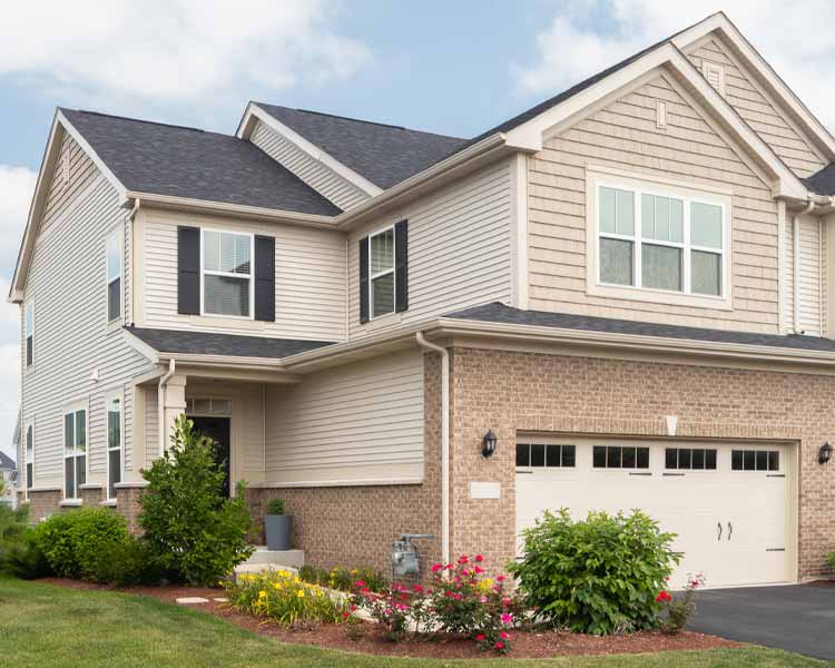 Beige siding home with garage