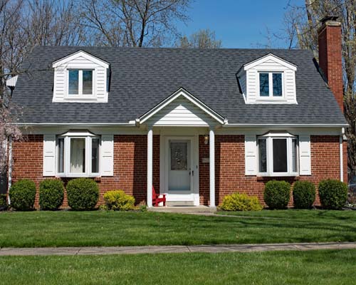 Red Brick home with shingle roof