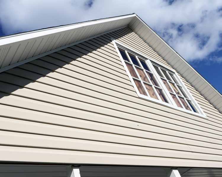 Orange/brown shingled roof with two white chimeny stacks