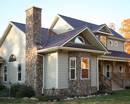 Beige home with stone chimney