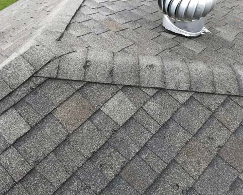 Dents in shingles from hail/storm